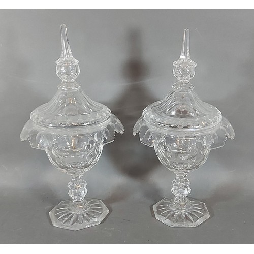 9 - A pair of glass covered bon bon comports with cut glass stems, 30cms tall