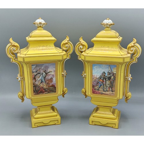 11 - A pair of Sevres porcelain covered two handled vases, each decorated with a reserve upon a yellow gr... 