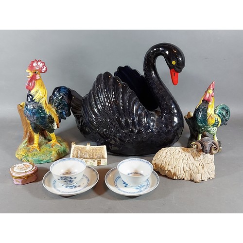 24 - A Dartmouth model of a swan together with other ceramics to include two teabowls and saucers from th... 