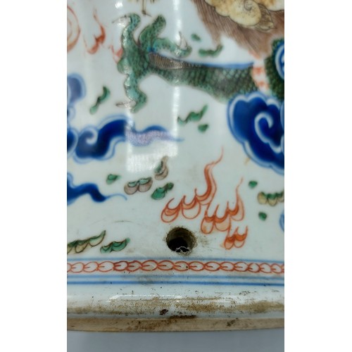 25 - A Chinese vase, decorated with serpents amongst foliage in coloured enamels, six character mark to b... 