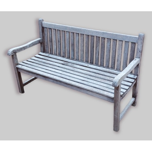 433 - A teak garden bench with slatted back and set, 150cms long