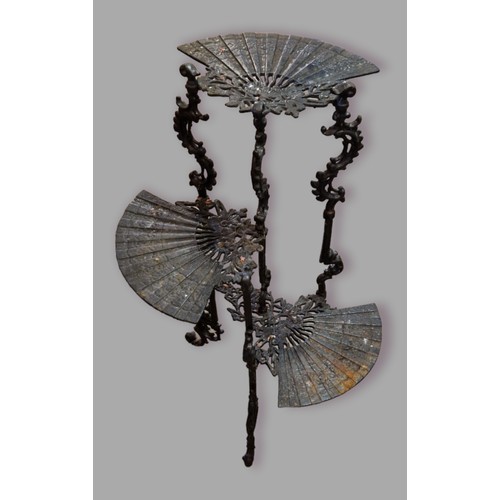 303 - A cast iron jardiniere stand with three platforms in the form of fans and with pierced supports, 75c... 