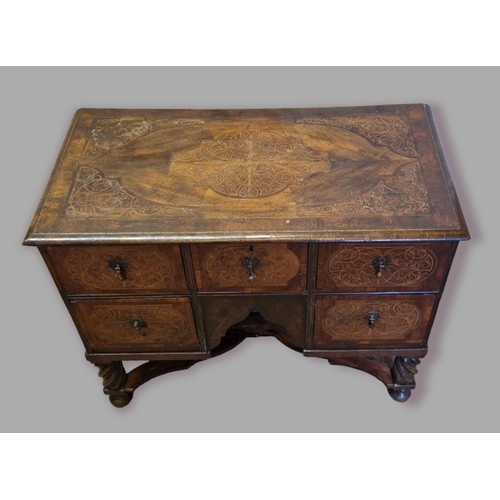 447 - An 18th Century North Italian side cabinet, the seaweed marquetry inlaid top above five similar draw... 