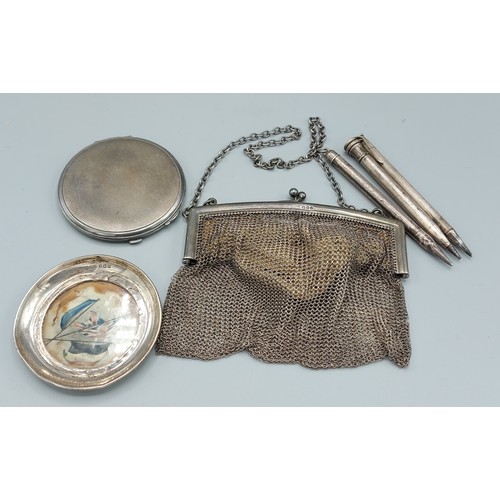 164 - A London silver chain link purse together with a Birmingham silver compact, a Birmingham silver dish... 