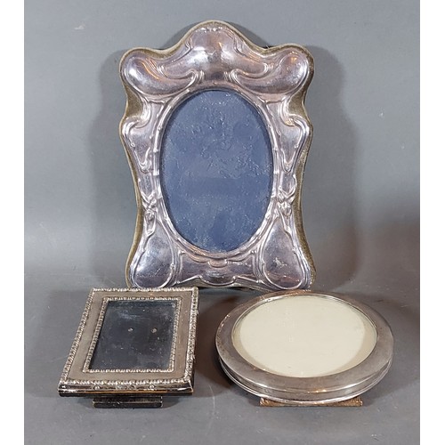 173 - A London silver photograph frame together with two other silver photograph frames