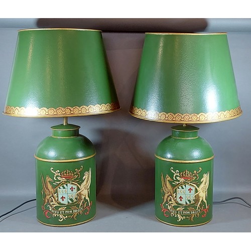 314 - A pair of Toleware table lamps, each decorated with an armorial crest on a green ground and with tol... 