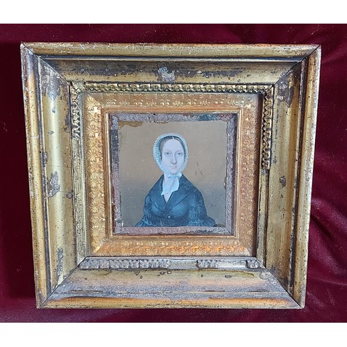 87 - A 19th Century portrait miniature of a lady in period dress, 8cms x 8cms