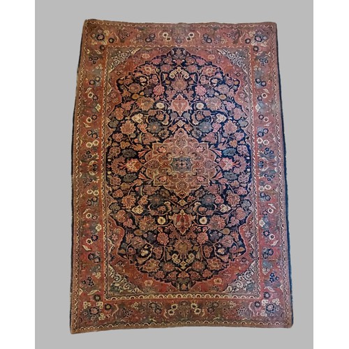 384 - A North West Persian woollen rug with all over design within multiple boarders, 200cm by 135cm