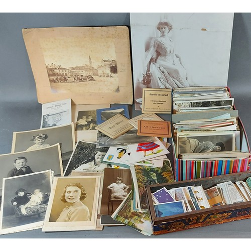 329 - A postcard collection together with early photographs and a collection of cigarette cards