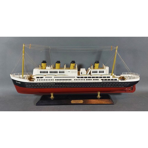 331 - ** Please Collect **A painted wooden scale model of the Titanic upon rectangular stand, 50cms long