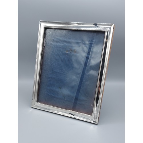 215 - A Birmingham silver rectangular photograph frame, 30cms x 24.5cms