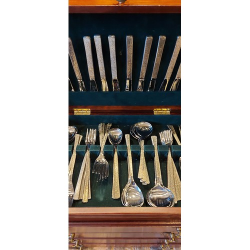 93 - A canteen of flatware by Viners within a mahogany canteen cabinet