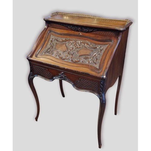 346 - A mahogany Bonheur De Jour, the brass gallery above a carved fall front enclosing a fitted interior,... 