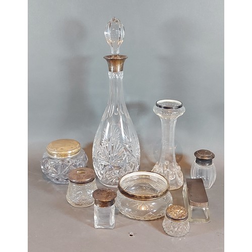 124 - A cut glass decanter with Birmingham silver collar together with a gass spill vase with silver rim a... 