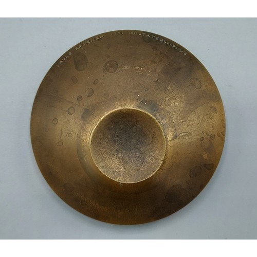 244 - Kauko Rasanen titled Kultateollisuus and dated 1971 a patinated bronze plaque, 7cms diameter