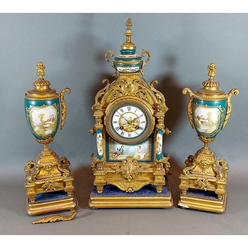 321 - A French spelter and porcelain mounted three piece clock garniture, the clock with two train movemen... 