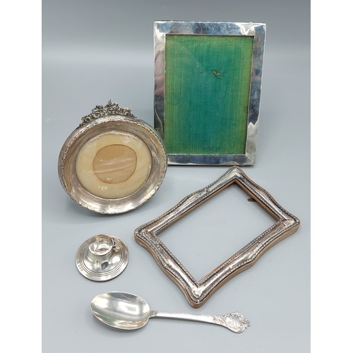 133 - A Birmingham silver miniature Capstan inkwell together with three silver photograph frames and a She... 