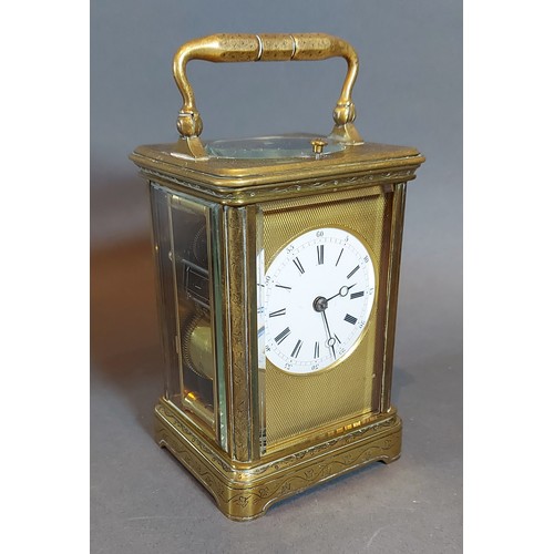 323 - A French engraved brass carriage clock, the repeater movement with lever escapement together with le... 