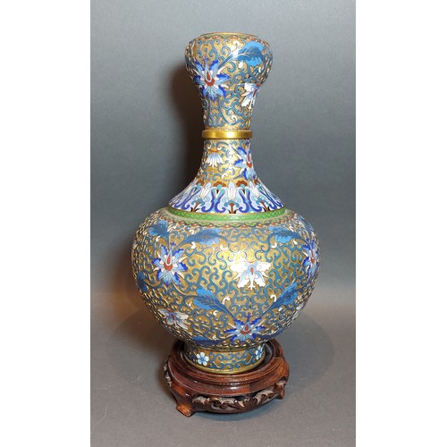 257 - A chinese Champleve bottle neck vase, decorated in polychrome enamels, 26cms tall