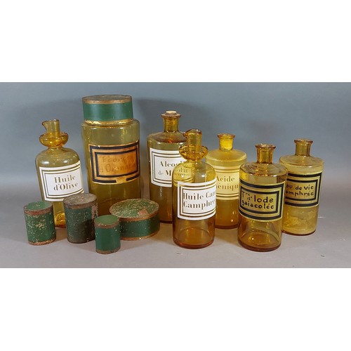 259 - A collection of seven amber glass apothecary jars