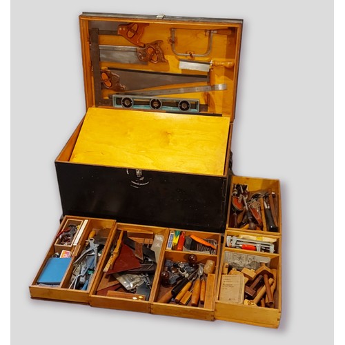 268 - A large wooden tool chest containing a collection of tools