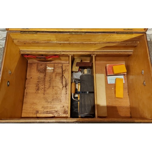 268 - A large wooden tool chest containing a collection of tools