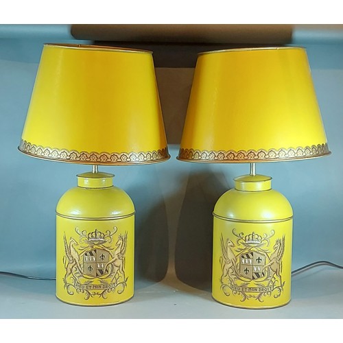 275 - A pair of Toleware table lamps, each decorated with a gilded crest upon a Mustard groundand with Tol... 