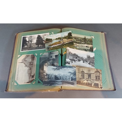 285 - A postcard album containing topographical and other postcards