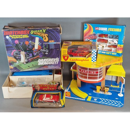 293 - A Matchbox Daredevil Dragout set in original box, together with a Mettoy garage, a Corgi Starsky and... 