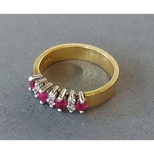 195 - An 18ct gold Ruby and diamond set band ring, 5.2gms