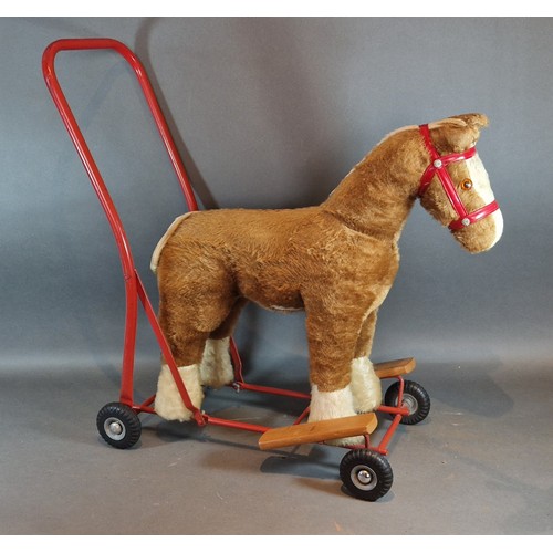 296 - A Pedigree Soft Toys Ltd ride on push along plush horse, 60cms tall