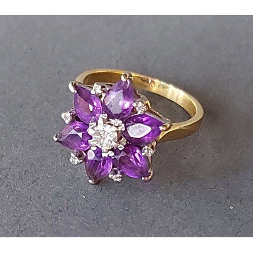 196 - An 18ct gold ring set with a central diamond surrounded by Amethysts, 6.5gms