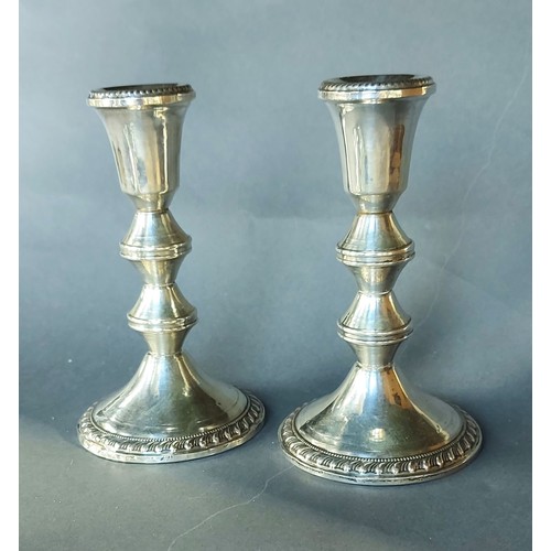 200 - A pair of Sterling silver candlesticks, 15.5cms tall