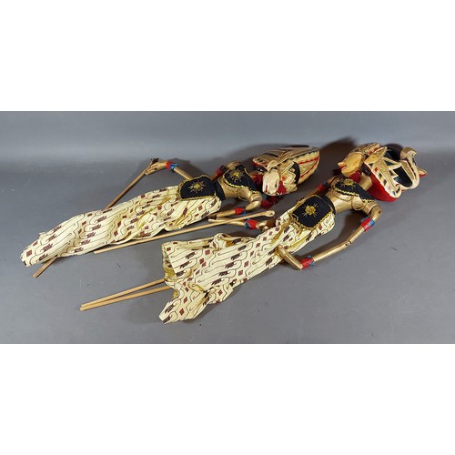 312 - A Pair of Indonesian Puppets with painted decoration, 54cm long