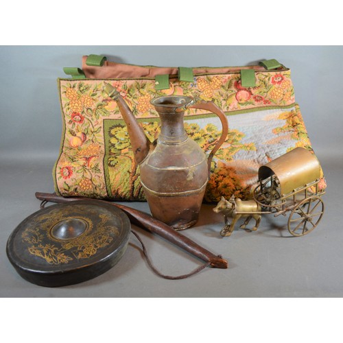 313 - A Persian copper jug together with a Chinese small gong, a brass horse and cart, a machine made wall... 