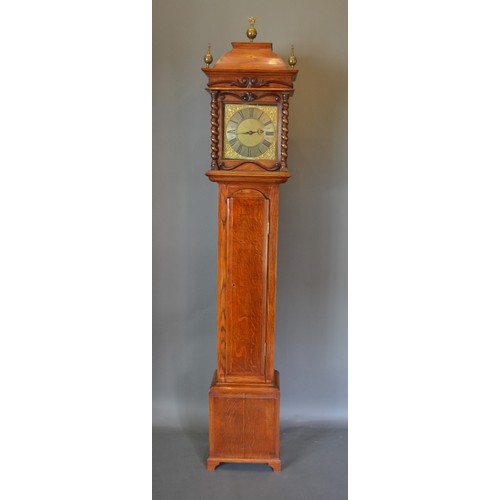 330 - A 19th Century oak long case clock the rectangular hood with brass finials above a rectangular door,... 