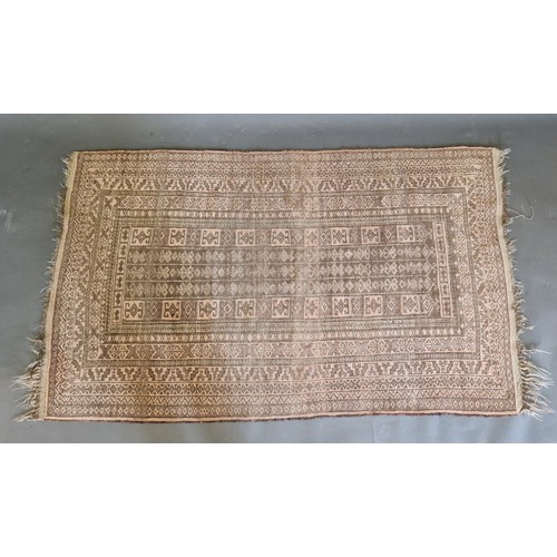 336 - An Afghan woollen rug with an all-over design upon a pale ground within multiple borders, 150cms x 9... 