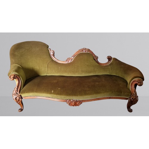 390 - A Victorian rosewood serpentine chaise longe, with a carved shaped back and raised upon cabriole leg... 