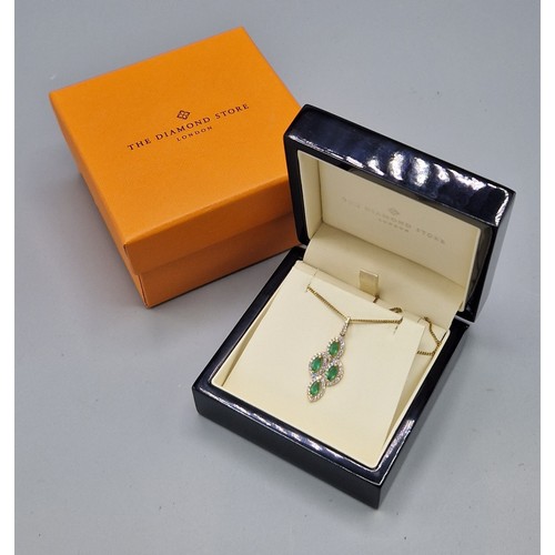 210 - An 18ct gold pendant set with four emeralds surrounded by diamonds with a 925 silver chain, 32mm by ... 