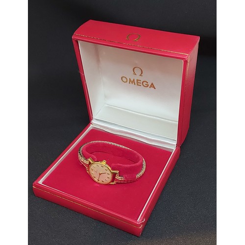 101 - An 18ct gold cased ladies wristwatch by Omega, with replacement expanding bracelet and original box