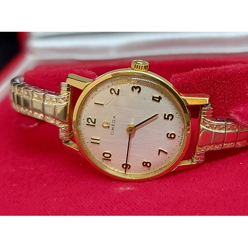 101 - An 18ct gold cased ladies wristwatch by Omega, with replacement expanding bracelet and original box