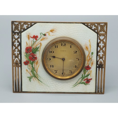 107 - A Birmingham silver and enamel decorated table clock, with pierced decoration, the white  guilloche ... 