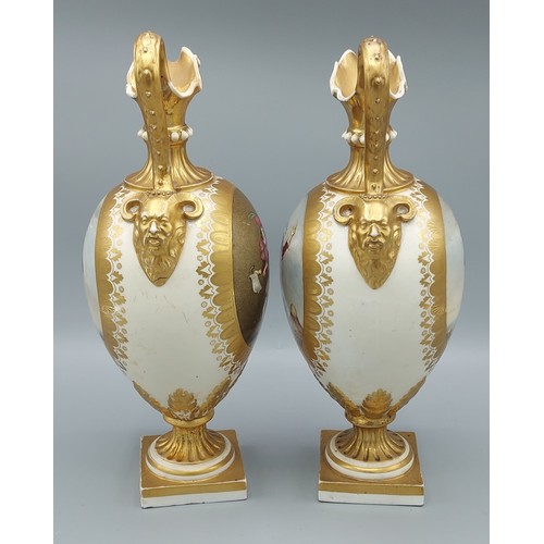 9 - A pair of 19th Century Bloor Derby jug vases, each with mask head handles and hand painted panels de... 