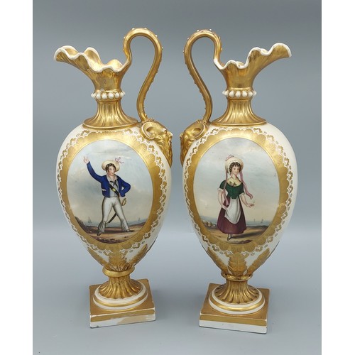 9 - A pair of 19th Century Bloor Derby jug vases, each with mask head handles and hand painted panels de... 