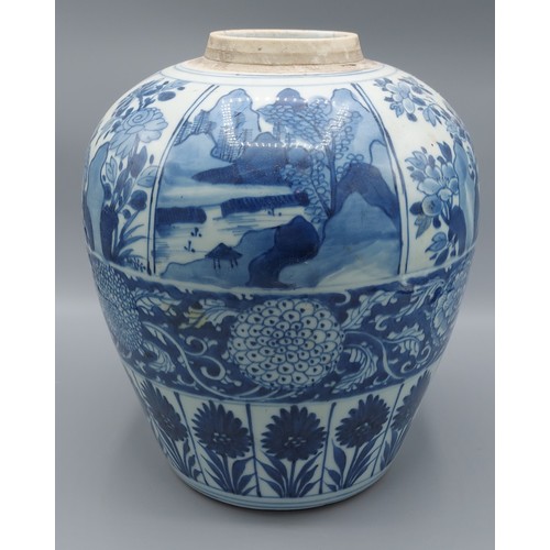 13 - A Chinese blue and white jar of tapering form decorated with   landscapes amongst foliage, 27cm tall