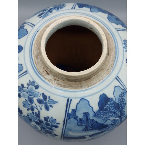 13 - A Chinese blue and white jar of tapering form decorated with   landscapes amongst foliage, 27cm tall