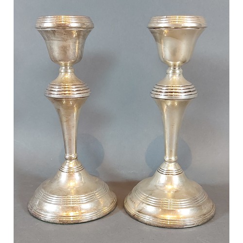 114 - A pair of Birmingham silver candlesticks, 18cms tall