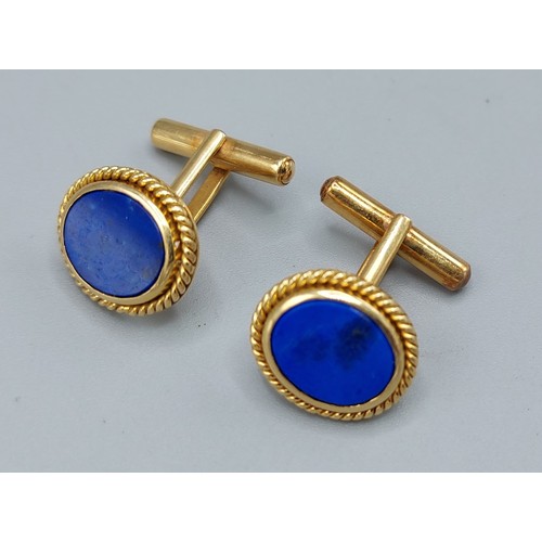 123 - A pair of 18ct gold and Lapis Lazuli cufflinks by Mecan Elde, 11.2gms