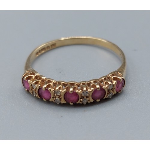 129 - A 9ct gold ring set with five rubies interspersed with diamonds, ring size P, 1.4gms