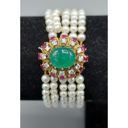 136 - A five strand pearl bracelet, the large 18ct whit and yellow gold clasp with central cabochon Emeral... 